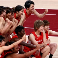 Player\'s from Japan\'s women\'s basketball team celebrate after their 102-83 win over Nigeria at Saitama Super Arena on Monday. | REUTERS