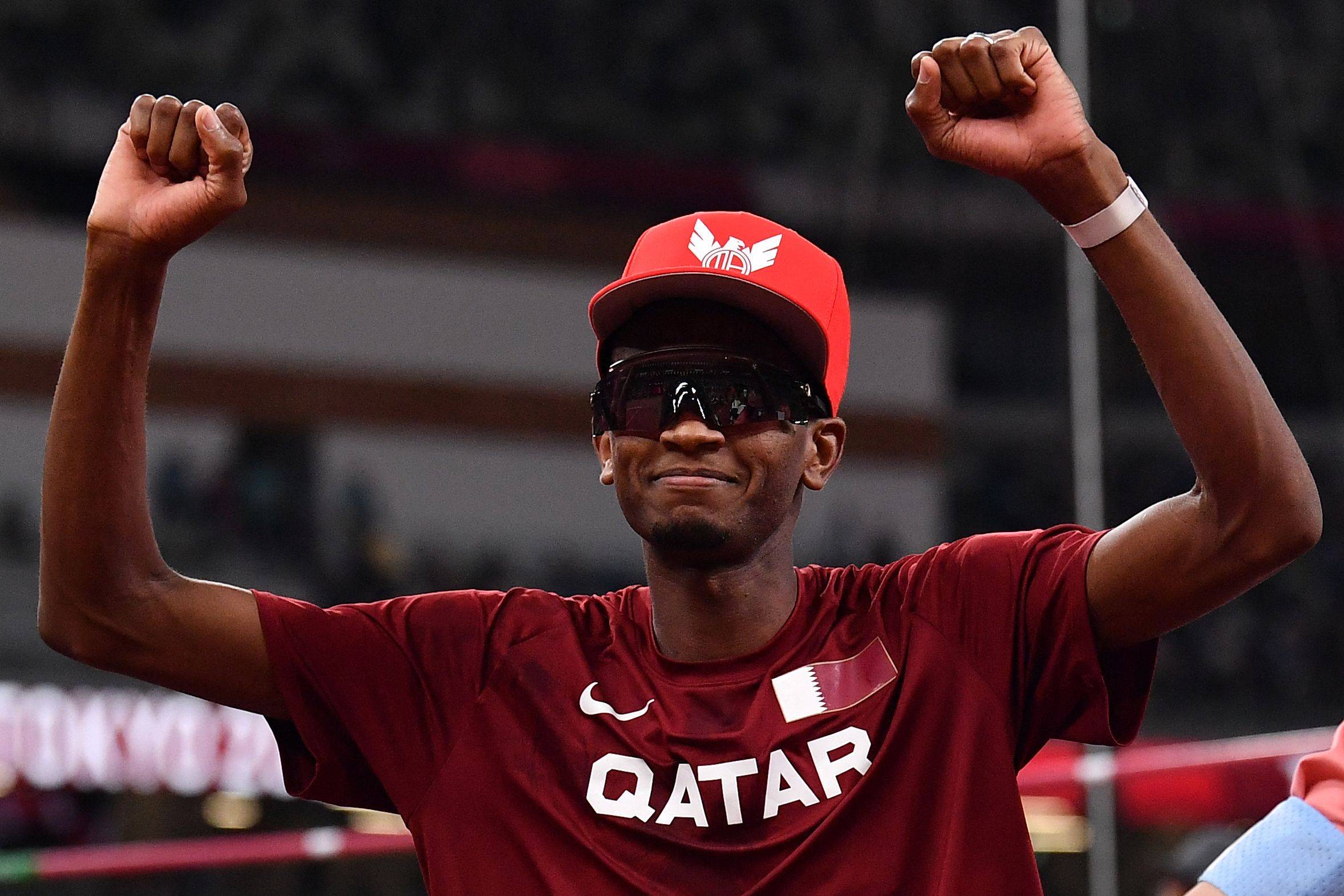 Mutaz Essa Barshim of Qatar celebrates after winning the gold in the men's high jump final during the Tokyo Olympics on Monday. | AFP-JIJI