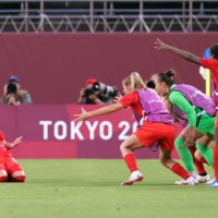 Jessie Fleming celebrates after scoring a second-half penalty as Canada upset four-time Olympic women\'s football champions the United States 1-0 in Kashima, Ibaraki Prefecture, on Monday to reach the final for the first time. | REUTERS
