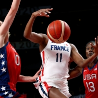 France\'s Valeriane Vukosavljevic in action with the U.S.\'s Breanna Stewart and Sylvia Fowles during a Group B game of women\'s basketball | REUTERS