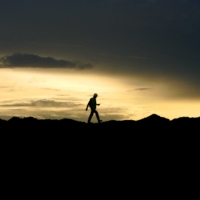 A worker walks over stockpiles of coal in Indonesia. | BLOOMBERG 