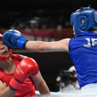Nesthy Petecio of the Philippines in action against Sena Irie of Japan in the Olympic final of the women\'s featherweight division.  | REUTERS