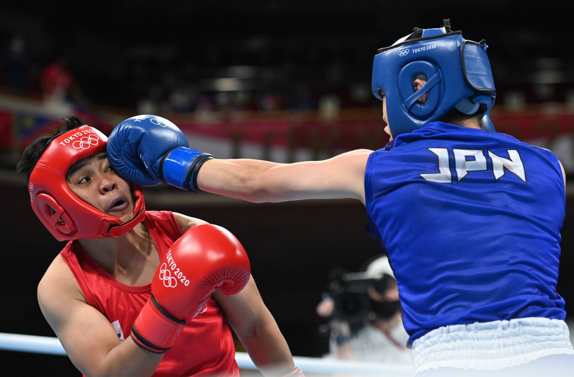 Nesthy Petecio of the Philippines in action against Sena Irie of Japan in the Olympic final of the women's featherweight division.  | Reuters