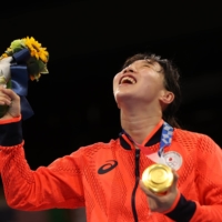 Gold medalist Sena Irie celebrates with her medal.  | REUTERS