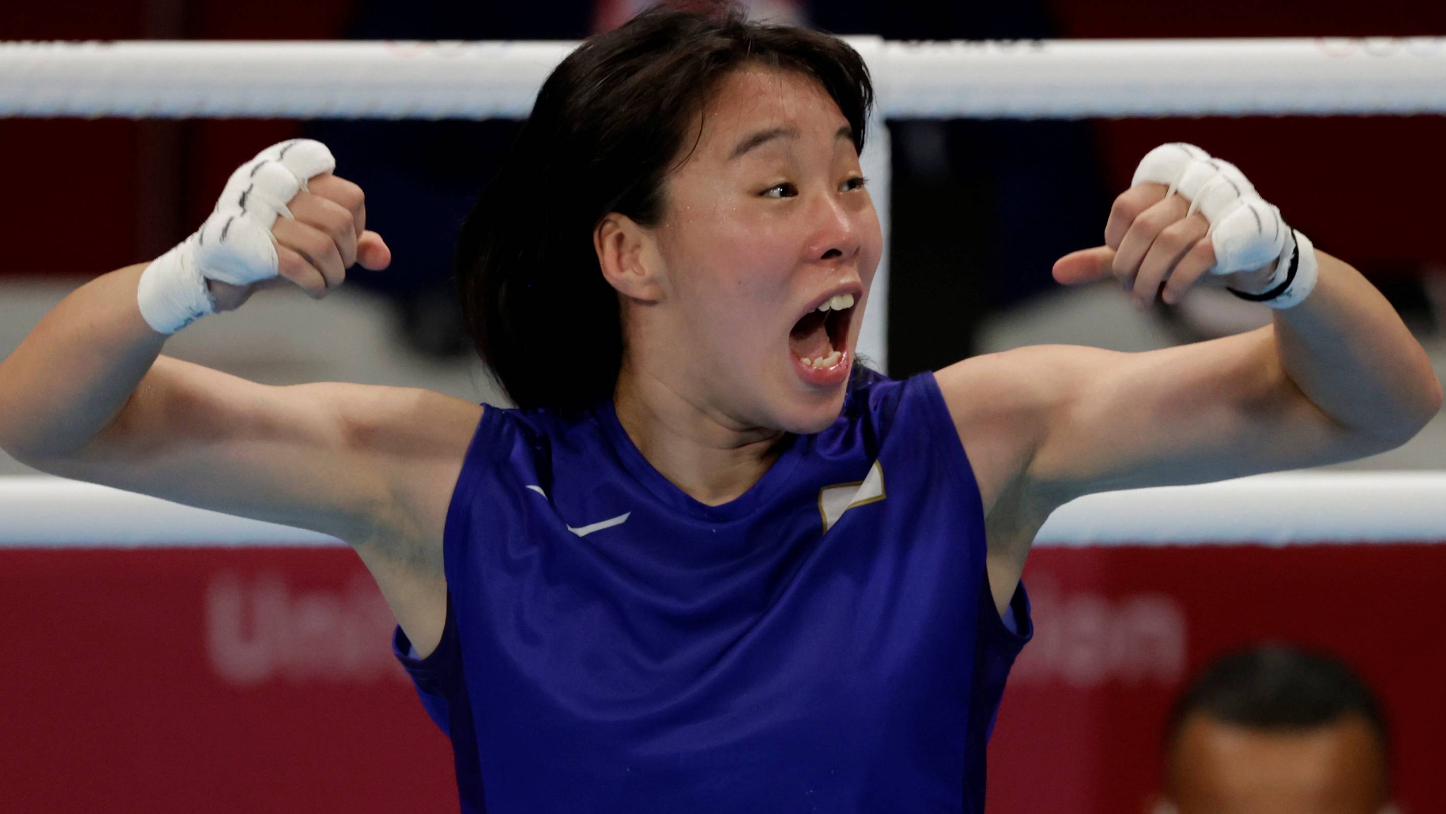 Sena Irie celebrates after winning the gold medal in the women's featherweight class.  | Reuters