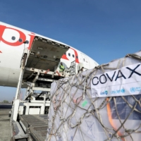 Ethiopian Airlines staff unload vaccine supplies provided through the COVAX system at Bole International Airport in Addis Ababa, Ethiopia, in March.  | REUTERS 