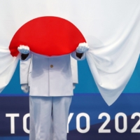 The Nikkei average usually rises during medal-heavy Olympics for Japan, but the market outlook this time is mixed. | BLOOMBERG