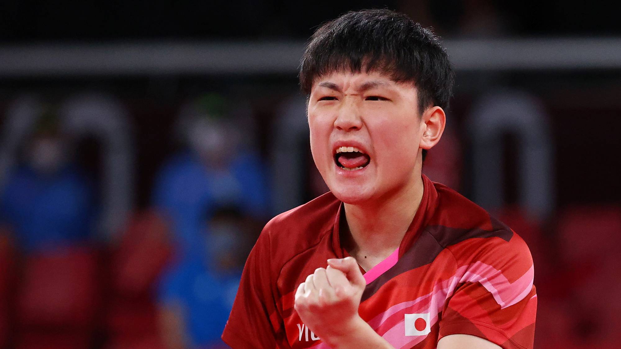 Tomokazu Harimoto of Japan reacts during his match against Anton Kallberg of Sweden. Japan's men's table tennis team advanced to the semifinals with its win over Sweden. | REUTERS