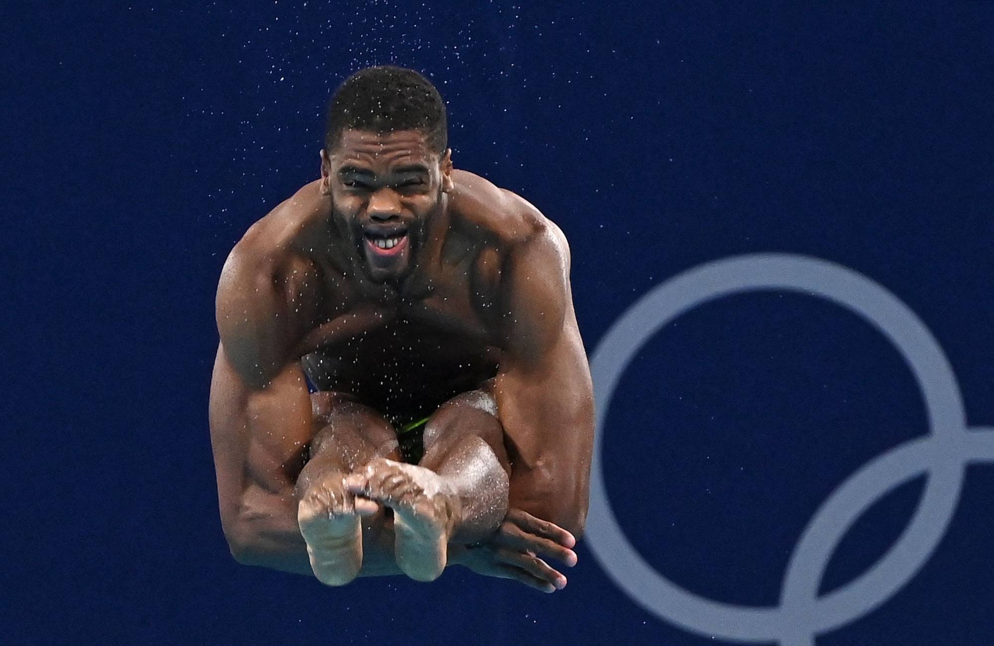 Jamaica's Yona Knight-Wisdom competes in the men's 3-meter springboard diving semi-final event | AFP-JIJI