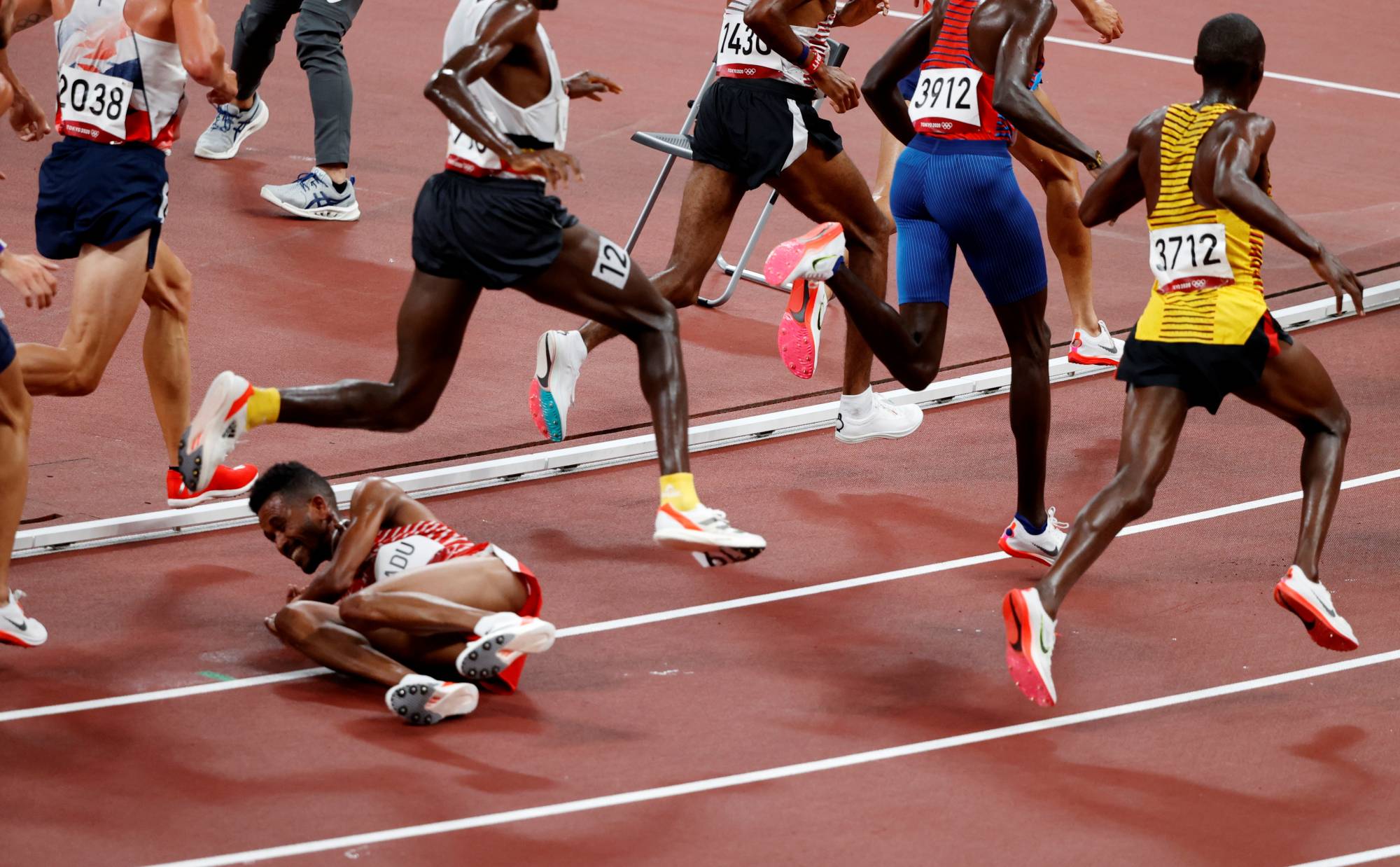 Bahrain's Dawit Fikadu falls down during Heat 2 of the men's 500-meter | REUTERS