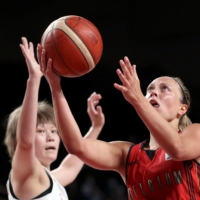 Belgium\'s Julie Allemand drives past Japan\'s Maki Takada during the women\'s quarterfinals on Wednesday at Saitama Super Arena.  | AFP-JIJI
