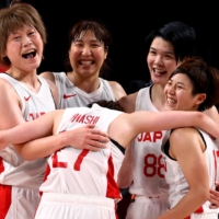 Team Japan celebrates after their quarterfinal win over Belgium on Wednesday.  | REUTERS
