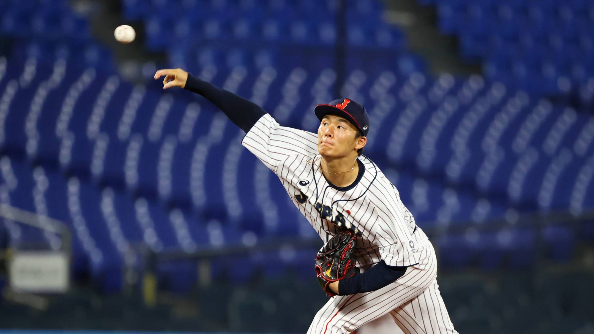 Japan starter Yoshinobu Yamamoto pitches against South Korea during their semifinal game in the Tokyo Olympics at Yokohama Stadium on Wednesday. | REUTERS