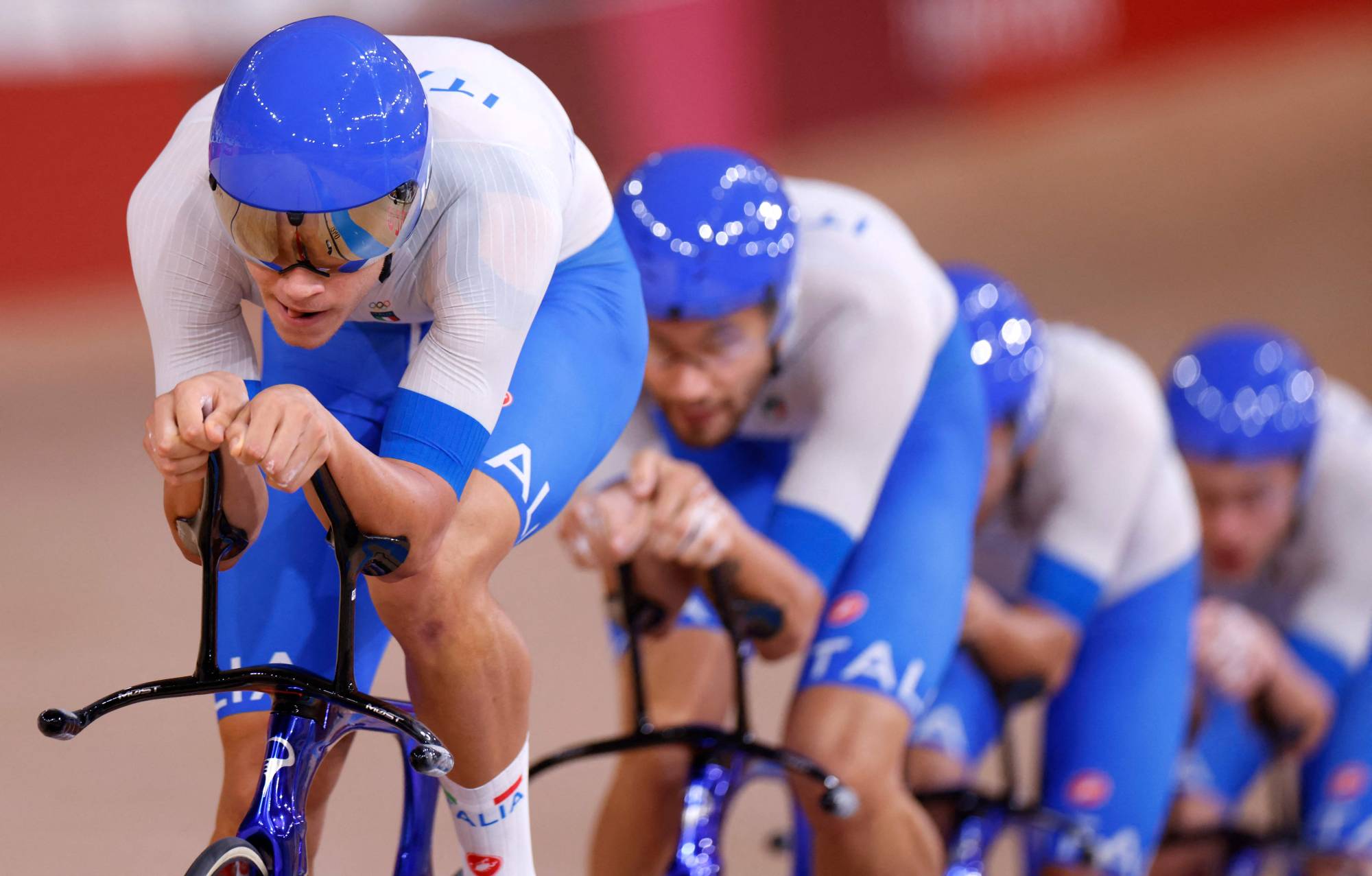 Italy's Jonathan Milan, Filippo Ganna, Francesco Lamon and Simone Consonni compete in the men's track team pursuit finals. | AFP-JIJI