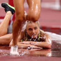 Australia\'s Genevieve Gregson after falling down during the final of the women\'s 3,000-meter steeplechase | REUTERS