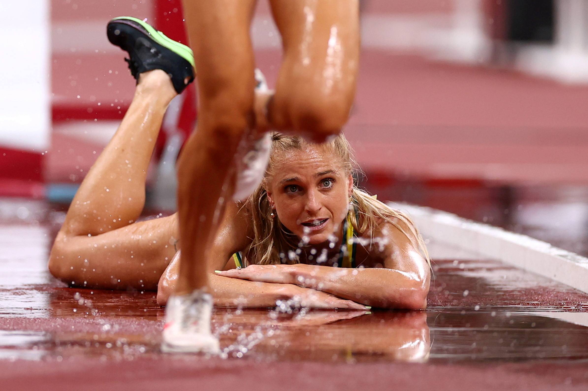 Australia's Genevieve Gregson after falling down during the final of the women's 3,000-meter steeplechase | REUTERS