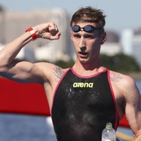 Florian Wellbrock of Germany celebrates winning gold in the men\'s 10-kilometer swim.  | REUTERS