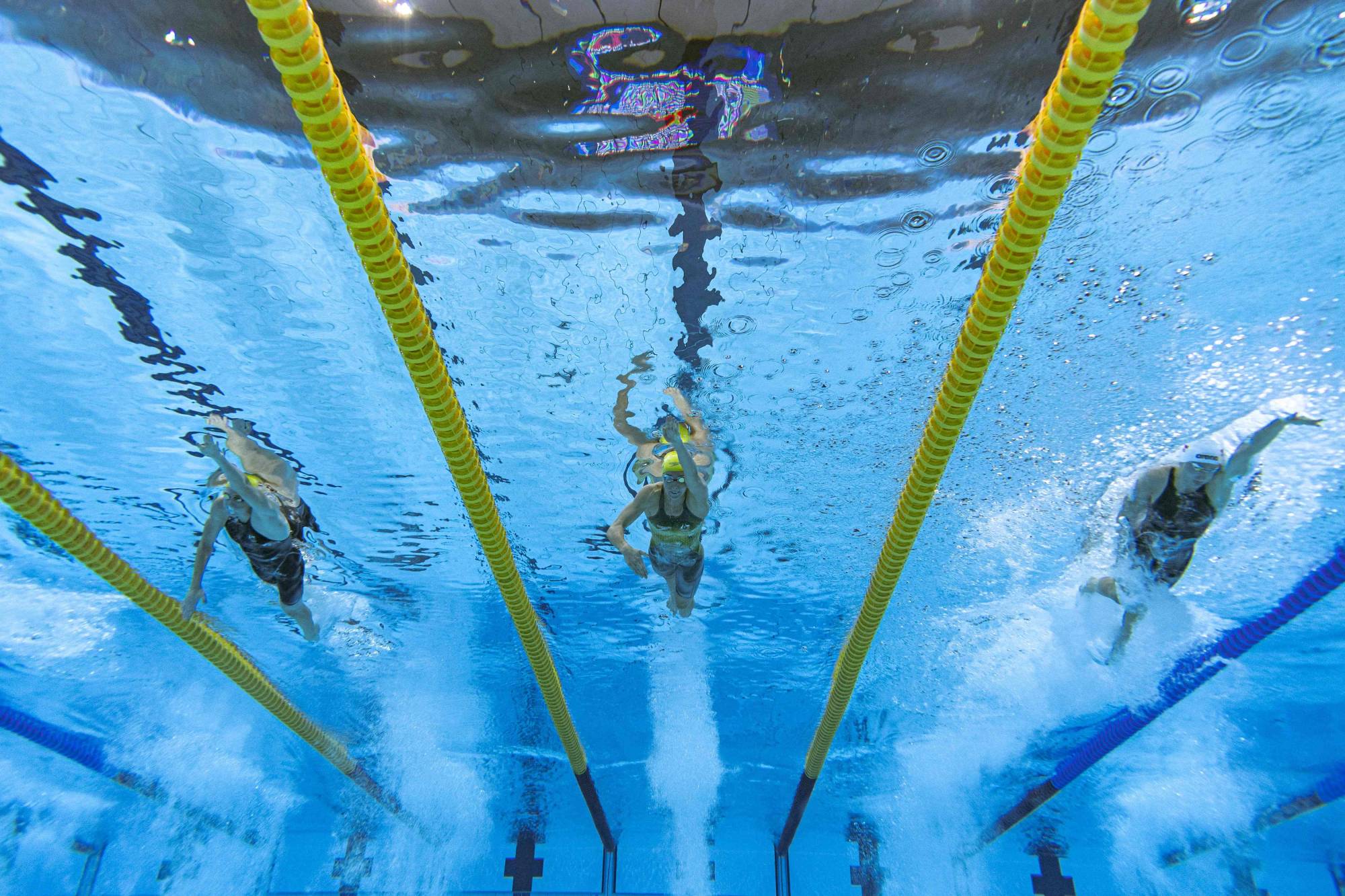 Australia's Cate Campbell (left) and Emma McKeon (center) race alongside Poland's Katarzyna Wasick on July 31.  | AFP-JIJI