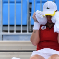Russian Anastasia Pavlyuchenkova tries to cool off during a break in her second-round tennis match on July 26.  | REUTERS