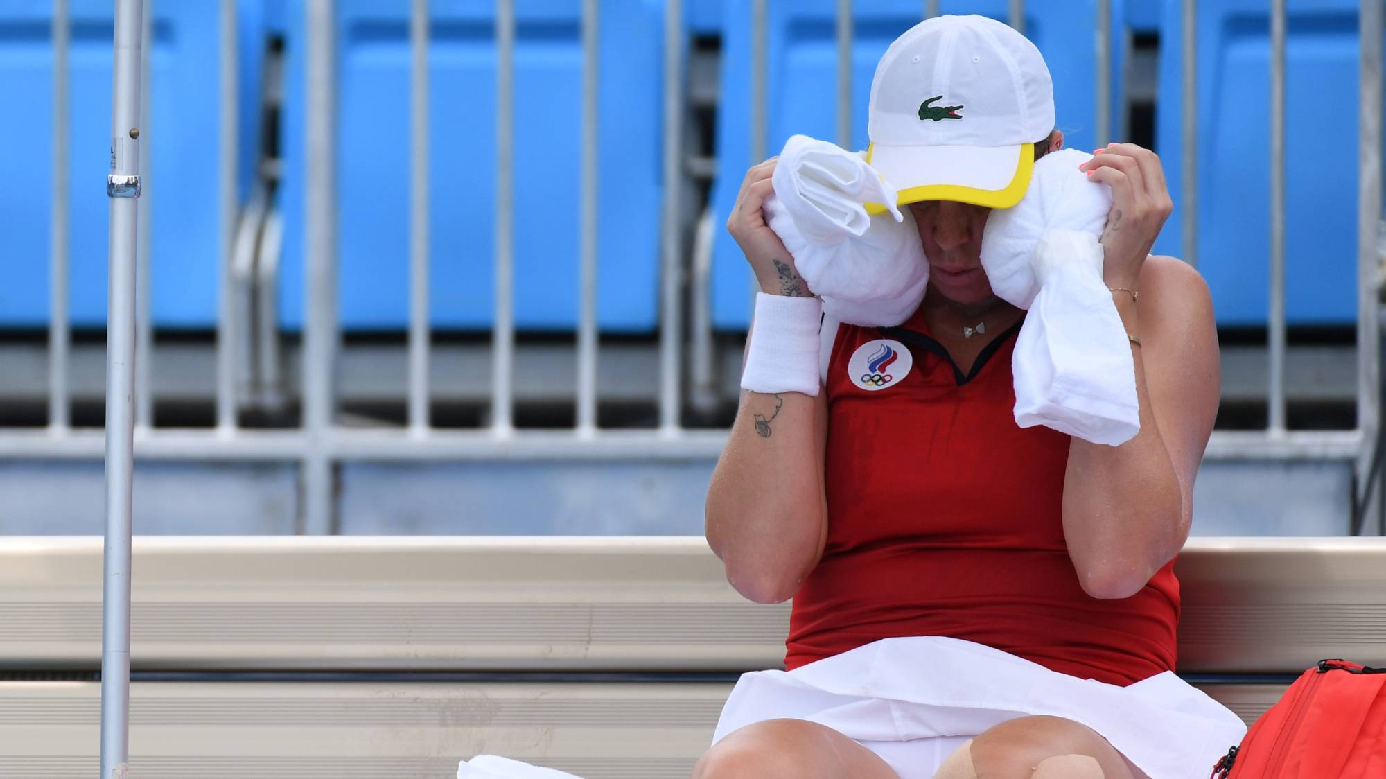 Russian Anastasia Pavlyuchenkova tries to cool off during a break in her second-round tennis match on July 26.  | Reuters