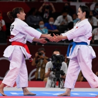 Spain\'s Sandra Sanchez Jaime (left) greets second place Japan\'s Kiyou Shimizu after she won the gold medal in the women\'s kata final of the karate competition during the Tokyo 2020 Olympic Games at the Nippon Budokan on Thursday. | AFP-JIJI