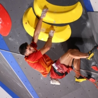 Alberto Gines Lopez climbs the lead wall during the men\'s sport climbing final at the Tokyo Olympics on Thursday. | REUTERS