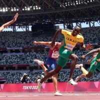 Jamaica\'s Hansle Parchmen crosses finish the line to win gold in the 110m hurdles final. | REUTERS