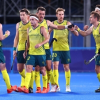 Tom Wickham of Australia\'s field hockey team celebrates with teammates after scoring. | REUTERS