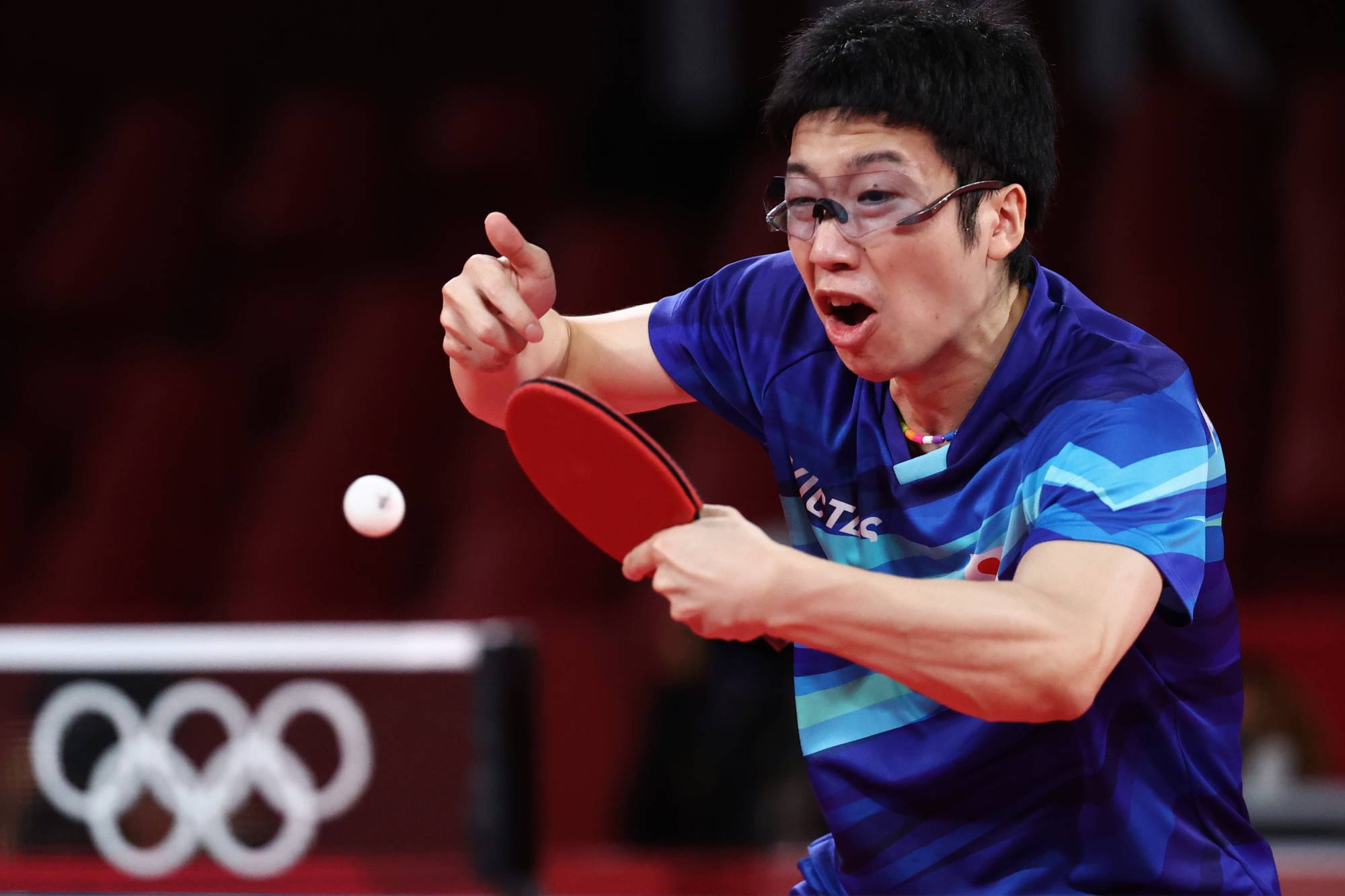 Japan's Jun Mizutani in action against South Korea's Jang Woojin in the bronze medal match of the men's team event. | REUTERS