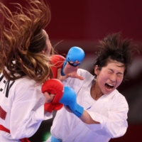 Mayumi Someya of Japan in action against Claudymar Garces of Venezuela, during the women\'s -61kg kumite competition. | REUTERS