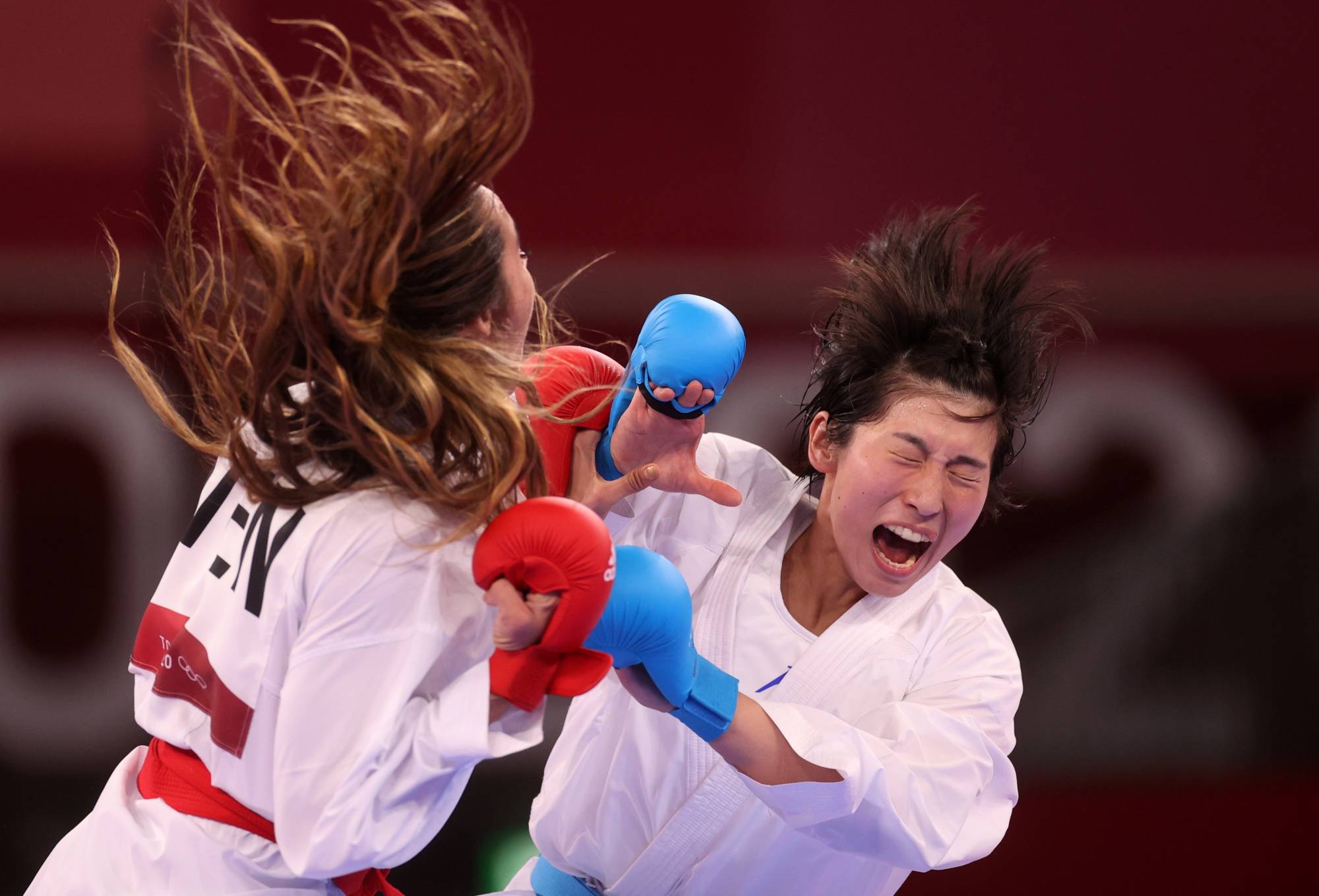 Mayumi Someya of Japan in action against Claudymar Garces of Venezuela, during the women's -61kg kumite competition. | REUTERS