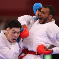 Japan\'s Ken Nishimura in action against Egypt\'s Abdalla Abdelaziz during the men\'s -75kg kumite competition. | REUTERS