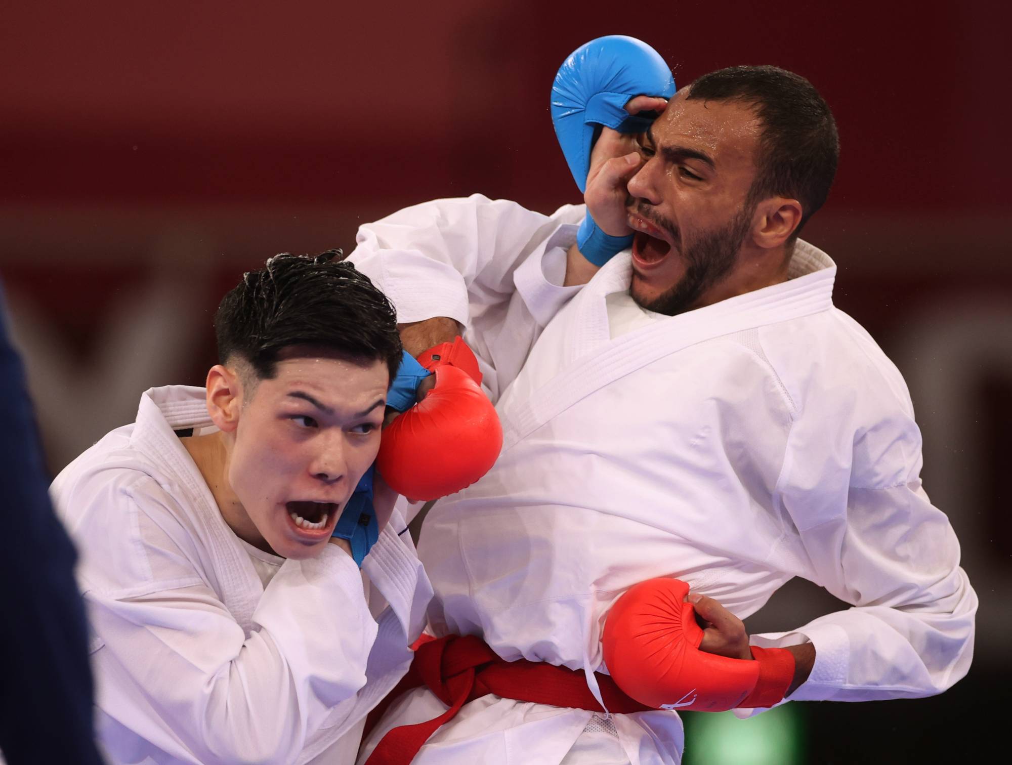 Japan's Ken Nishimura in action against Egypt's Abdalla Abdelaziz during the men's -75kg kumite competition. | REUTERS