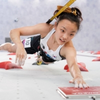 South Korea\'s Seo Chae-hyun reaches the top of the wall in the women\'s sport climbing speed quarterfinals | AFP-JIJI