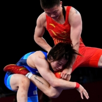 Japan\'s Mayu Mukaida won gold in in the 53-kilogram wrestling final, downing China\'s Pang Qianyu 5-4.  | REUTERS