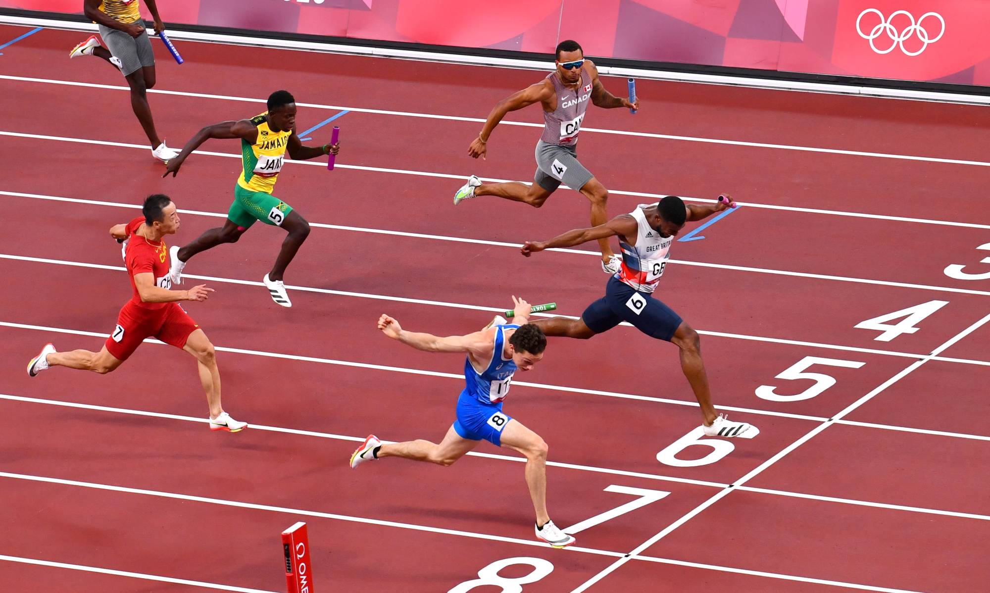 Italy's Filippo Tortu crosses the line to win gold ahead of Britain's Nethaneel Mitchell-Blake. | REUTERS
