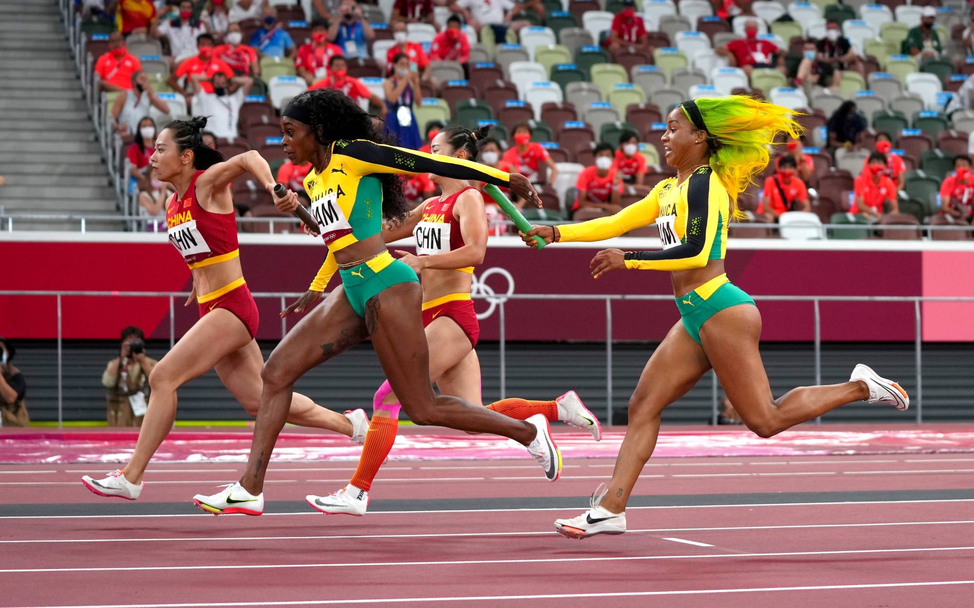 A baton pass during the women's 4 x 100-meter relay | REUTERS