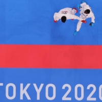 Ryutaro Araga of Japan in action against Tareg Hamedi of Saudi Arabia in the men\'s kumite over-75 kg semifinals. | REUTERS