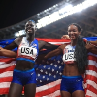 Team USA celebrates after winning gold in the women\'s 4x400 meter relay. | REUTERS