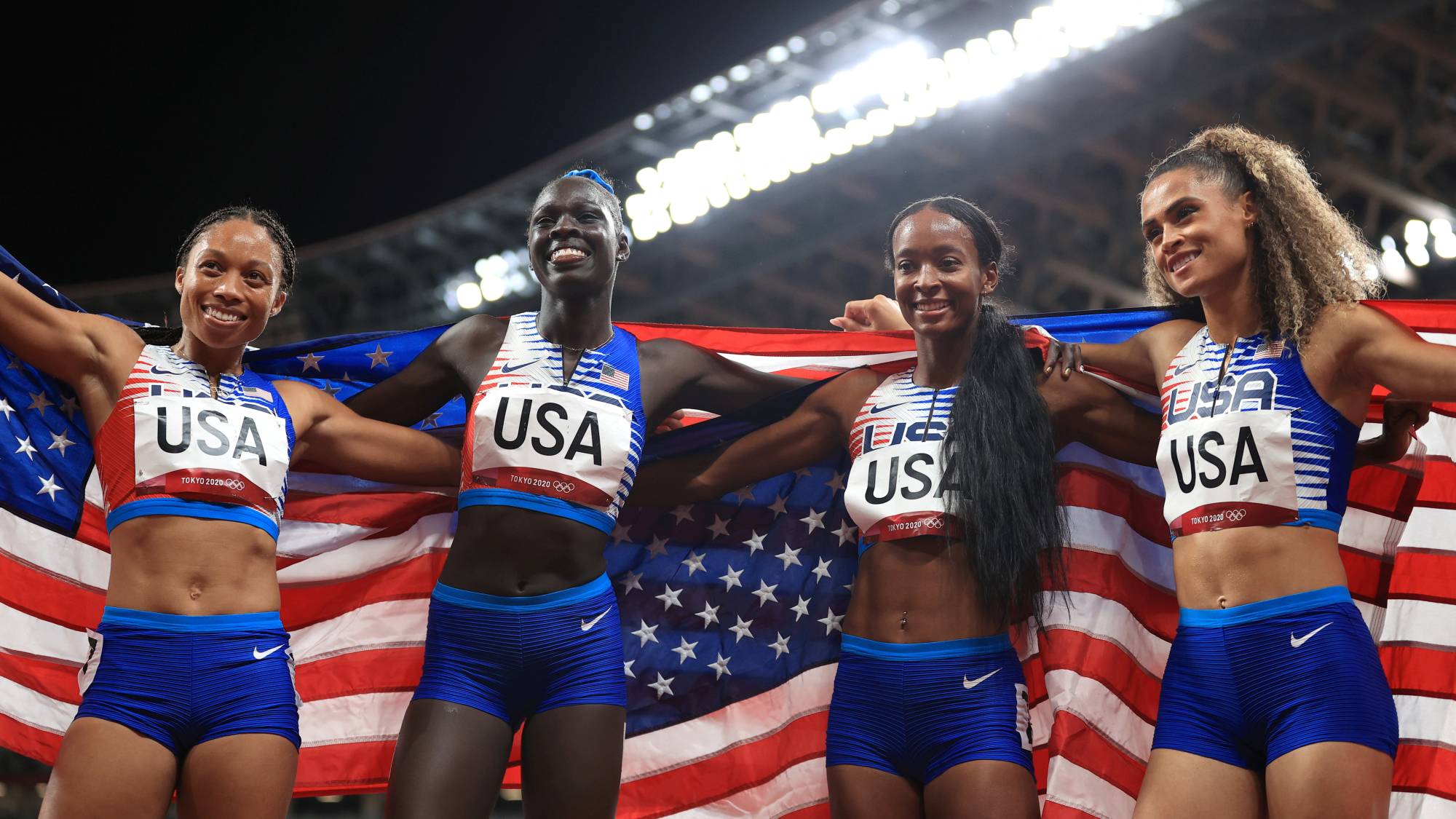 Team USA celebrates after winning gold in the women's 4x400 meter relay. | REUTERS
