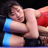 Japan\'s Yui Susaki wraps up China\'s Sun Yanan on her way to Olympic gold in the women\'s 50 kg division. | REUTERS