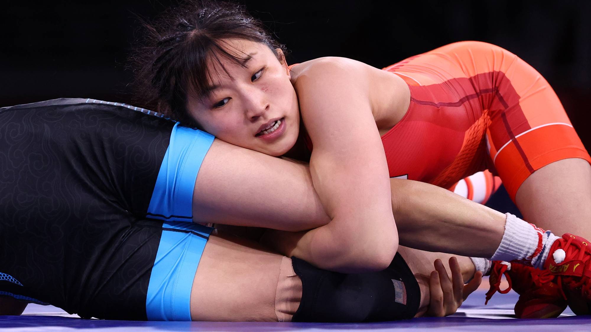 Japan's Yui Susaki wraps up China's Sun Yanan on her way to Olympic gold in the women's 50 kg division. | REUTERS