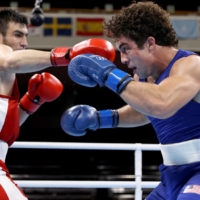 Bakhodir Jalolov of Uzbekistan in action against Richard Torrez of the United States during the final of the men\'s super heavyweight | POOL VIA REUTERS
