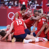 Members of USA\'s women\'s volleyball after winning their gold medal match against Brazil.  | REUTERS