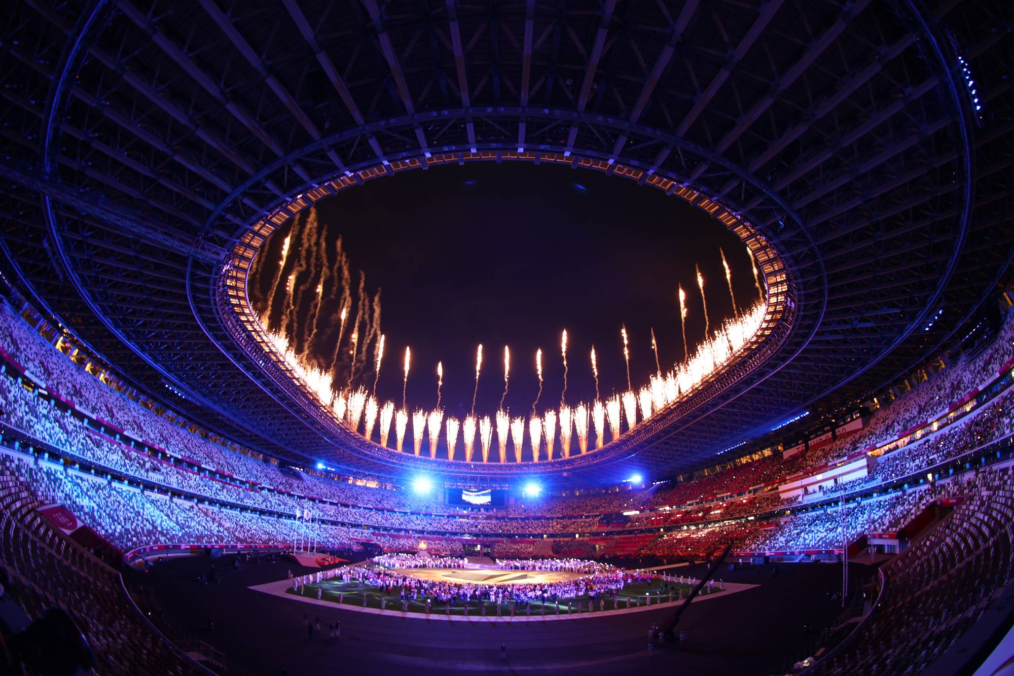 Fireworks explode at Tokyo's National Stadium during the closing ceremony of the Olympics. | REUTERS