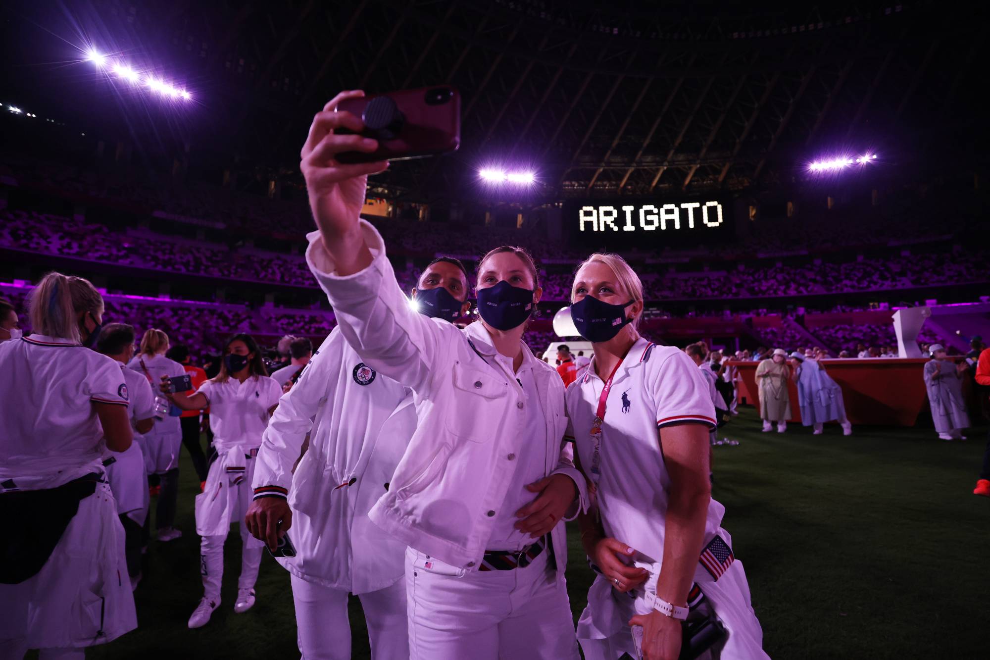 Athletes take a selfie during the closing ceremony | POOL VIA REUTERS