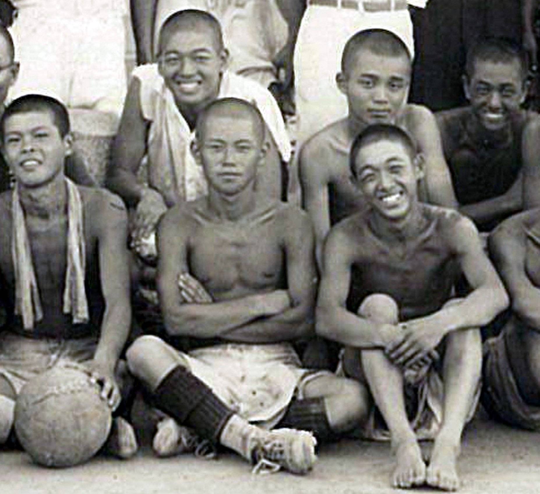 Shunji Okada (back row, second from right) participates in a school soccer club practice as a former team member during the summer after he graduated from the Okayama second middle school in March 1942. | Courtesy of Masakatsu Takeyari 