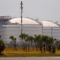 Liquefied natural gas storage tanks at an ExxonMobil PNG plant in Port Moresby, Papua New Guinea | REUTERS 