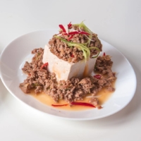 Tomato-avocado caprese hiyayakko (left) and spicy miso-meat hiyayakko are quick, easy and (most importantly) chilled. | MAKIKO ITOH
