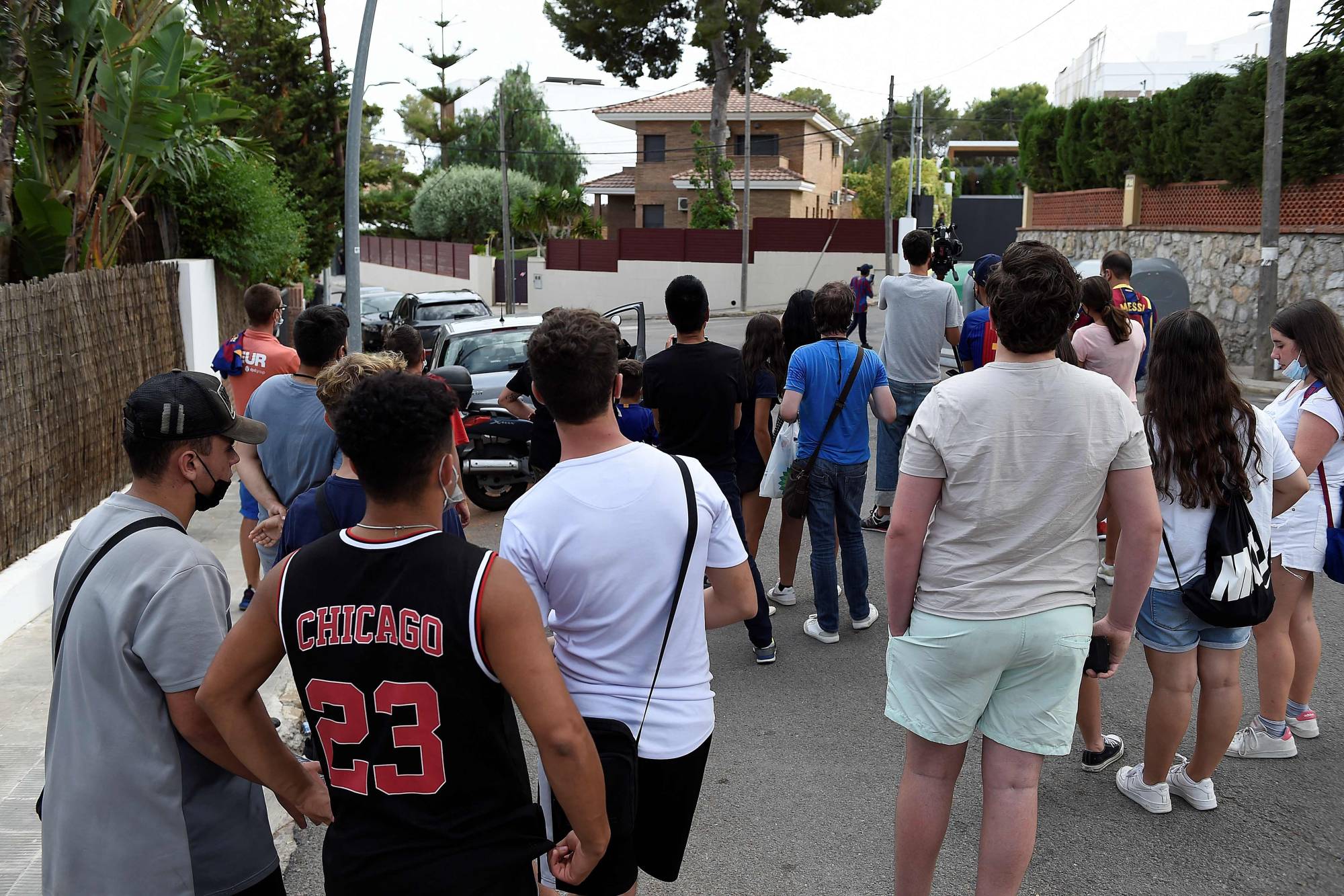 Fans gather outside the home of Lionel Messi in Barcelona on Monday. | AFP-Jiji
